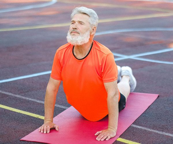 Man stretching and feeling vital energy after practice